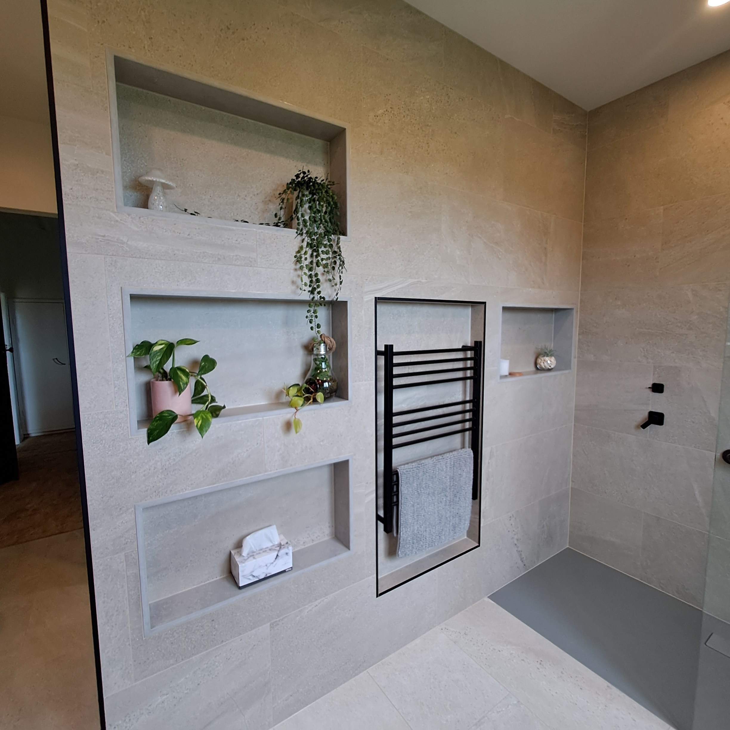 Modern luxury bathroom with floor to ceiling tiles